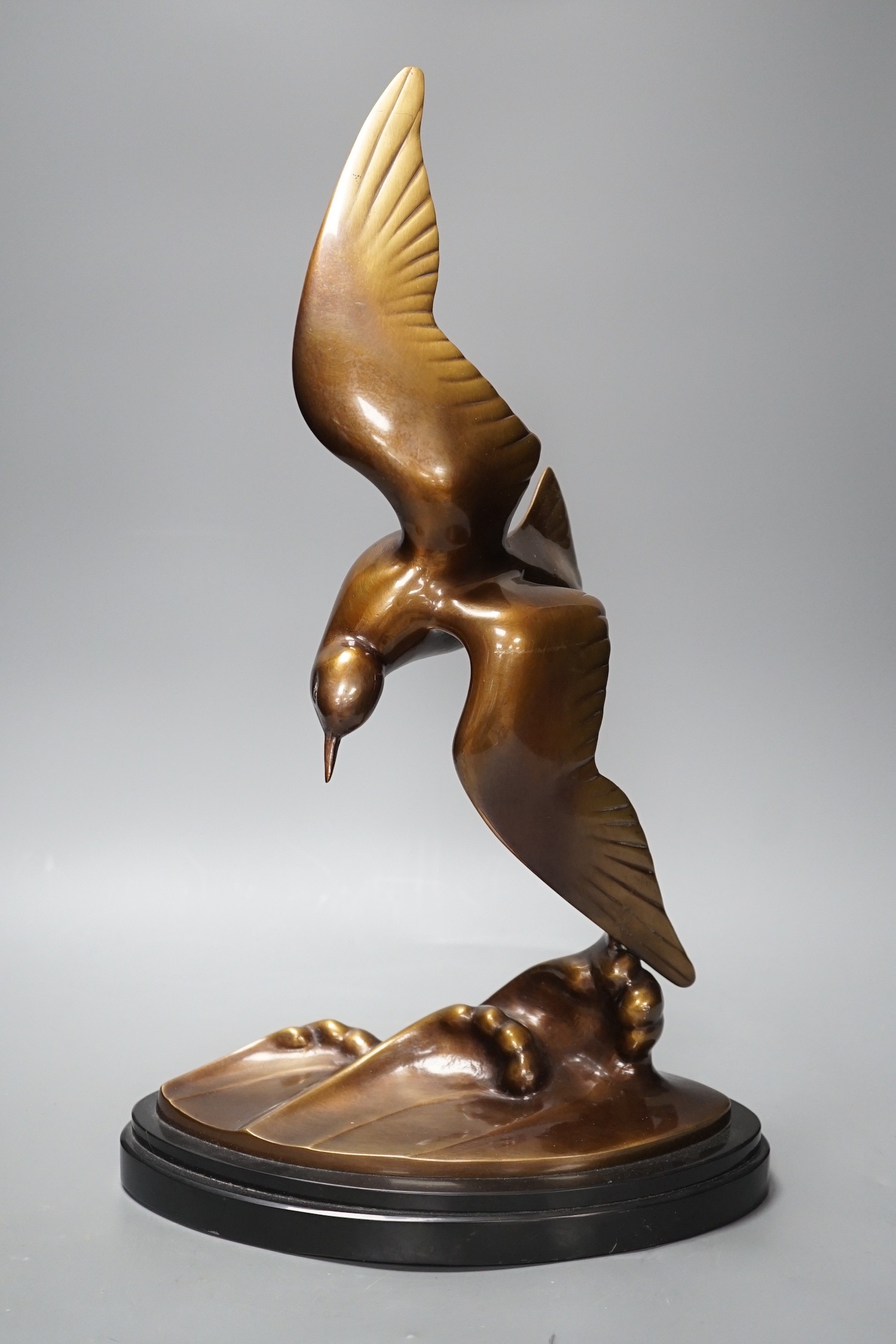 An Art Deco patinated bronze figure of a seabird, signed J B Leonard, 47 cms high